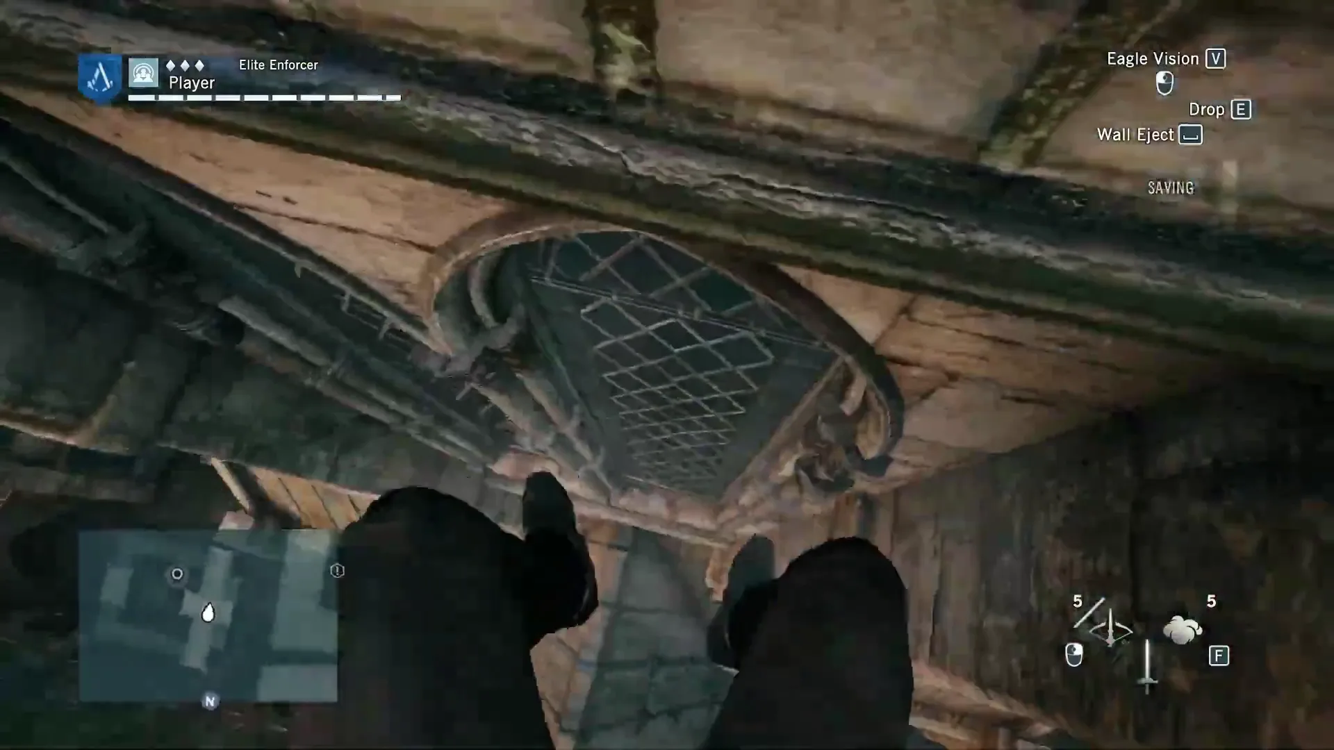 First-person view looking up at a carved stone window while climbing, with Arno's gloved hands on the wall
