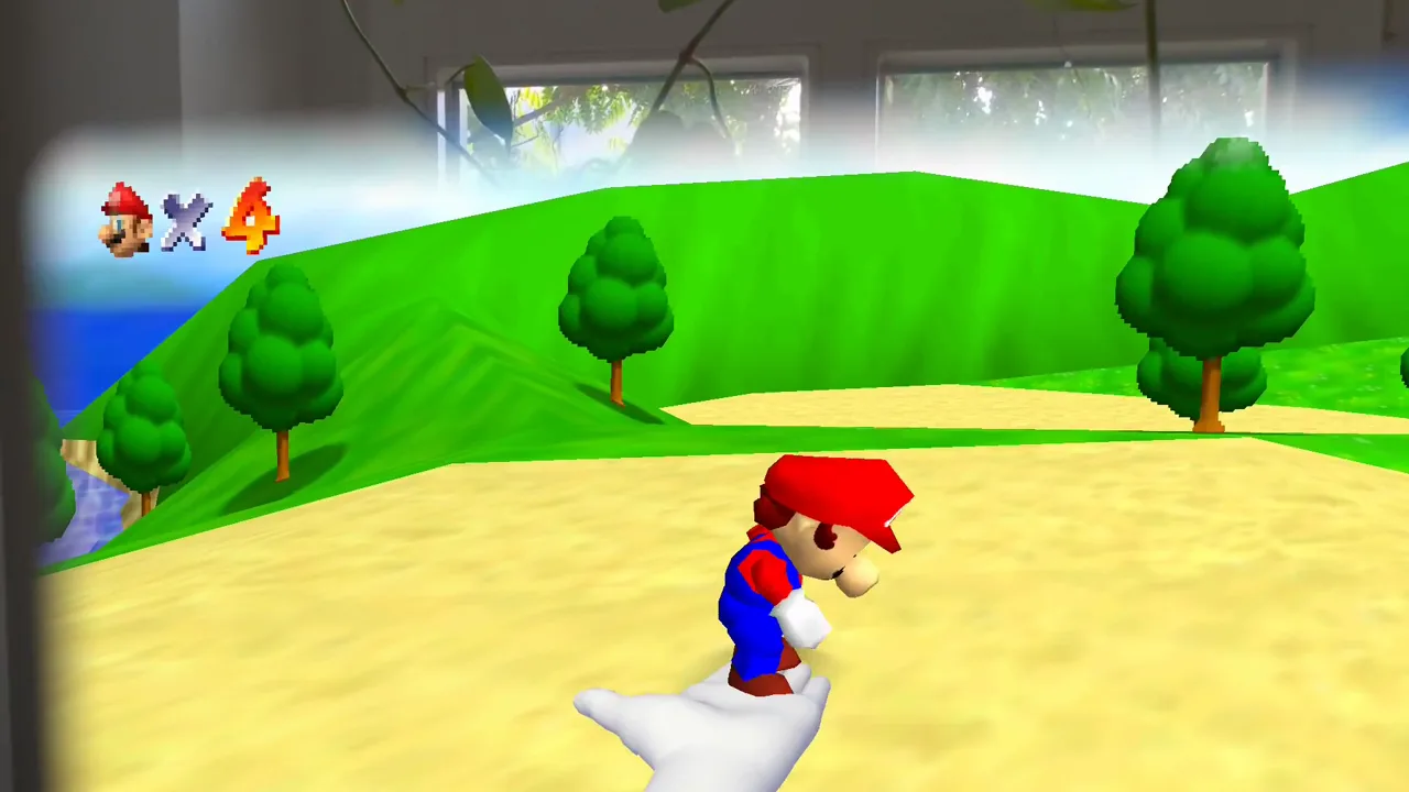 Mario stands on a white cartoon glove inside a floating window of Bob-omb Battlefield, with a real room visible around the edges